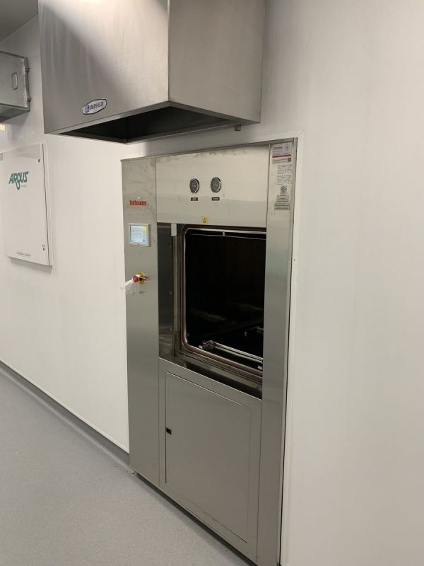 Tuttnauer 66E double-door autoclave recessed in a white wall below an exhaust hood at Optimi Health in Princeton, BC