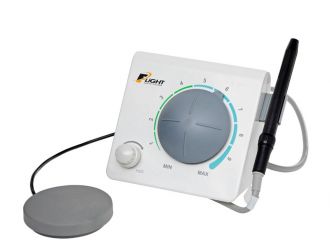 Flight tabletop ultrasonic scaler with handpiece and foot control